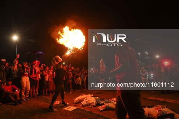 Protesters hold a demonstration against the fires and the climate situation in Brazil and for agrarian reform on Avenida Paulista, in the ce...