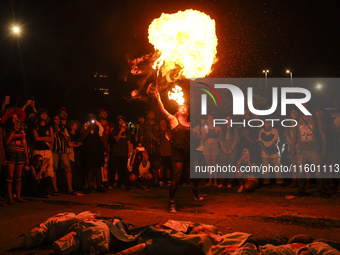 Protesters hold a demonstration against the fires and the climate situation in Brazil and for agrarian reform on Avenida Paulista, in the ce...