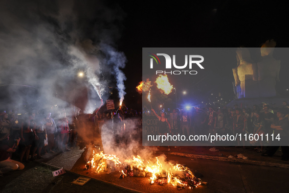 Protesters hold a demonstration against the fires and the climate situation in Brazil and for agrarian reform on Avenida Paulista, in the ce...