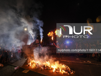 Protesters hold a demonstration against the fires and the climate situation in Brazil and for agrarian reform on Avenida Paulista, in the ce...