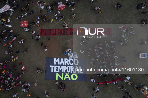 Protesters hold a demonstration against the fires and the climate situation in Brazil and for agrarian reform on Avenida Paulista, in the ce...