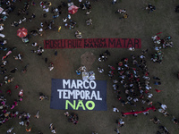 Protesters hold a demonstration against the fires and the climate situation in Brazil and for agrarian reform on Avenida Paulista, in the ce...