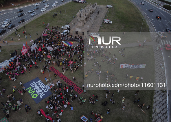 Protesters hold a demonstration against the fires and the climate situation in Brazil and for agrarian reform on Avenida Paulista, in the ce...