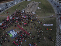 Protesters hold a demonstration against the fires and the climate situation in Brazil and for agrarian reform on Avenida Paulista, in the ce...