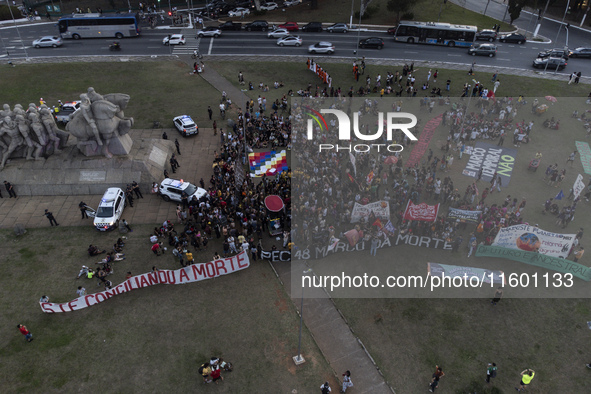 Protesters hold a demonstration against the fires and the climate situation in Brazil and for agrarian reform on Avenida Paulista, in the ce...