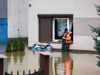 A man stands in the water after Nysa Klodzka river flooded town of Lewin Brzeski in southwestern Poland, on September 19th, 2024. Storm Bori...