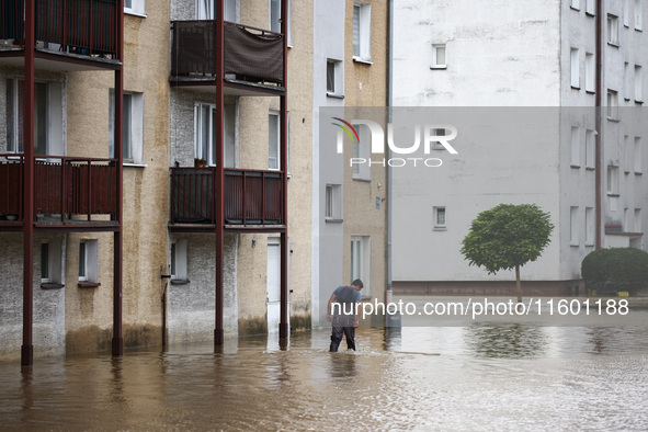 A man walks in the water after Nysa Klodzka river flooded town of Lewin Brzeski in southwestern Poland, on September 19th, 2024. Storm Boris...