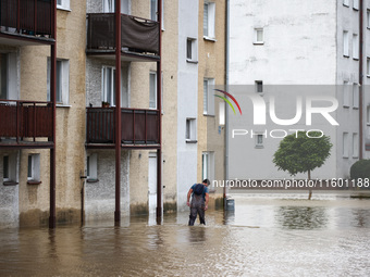 A man walks in the water after Nysa Klodzka river flooded town of Lewin Brzeski in southwestern Poland, on September 19th, 2024. Storm Boris...