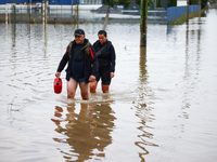 Residents walk in the water after Nysa Klodzka river flooded town of Lewin Brzeski in southwestern Poland, on September 19th, 2024. Storm Bo...