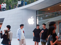 Customers experience Apple's new flagship mobile phone, the iPhone 16, at the largest Apple flagship store in Asia in Shanghai, China, on Se...