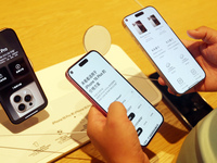 Customers experience Apple's new flagship mobile phone, the iPhone 16, at the largest Apple flagship store in Asia in Shanghai, China, on Se...