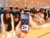 Customers experience Apple's new flagship mobile phone, the iPhone 16, at the largest Apple flagship store in Asia in Shanghai, China, on Se...