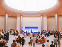 Customers experience Apple's new flagship mobile phone, the iPhone 16, at the largest Apple flagship store in Asia in Shanghai, China, on Se...