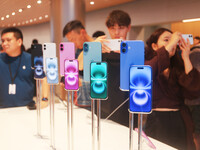 Customers experience Apple's new flagship mobile phone, the iPhone 16, at the largest Apple flagship store in Asia in Shanghai, China, on Se...