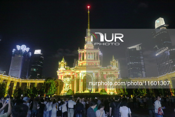 Visitors visit a historic landmark and classic Russian design exhibition center transformed into a ''Disneyland castle'' to celebrate China'...