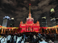 Visitors visit a historic landmark and classic Russian design exhibition center transformed into a ''Disneyland castle'' to celebrate China'...