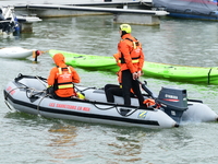 Sea rescuers on a boat monitor the descent on the Saone of the Lyon Kayak in Lyon, France, on September 22, 2024. (