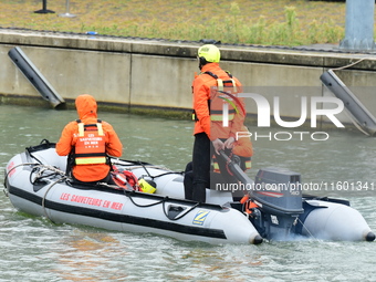 Sea rescuers on a boat monitor the descent on the Saone of the Lyon Kayak in Lyon, France, on September 22, 2024. (