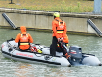 Sea rescuers on a boat monitor the descent on the Saone of the Lyon Kayak in Lyon, France, on September 22, 2024. (