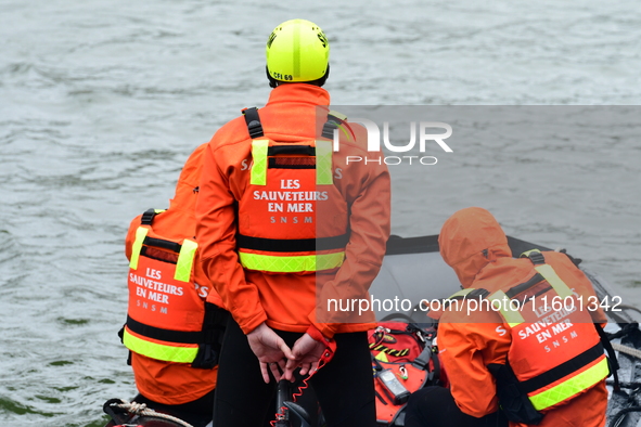 Sea rescuers on a boat monitor the descent on the Saone of the Lyon Kayak in Lyon, France, on September 22, 2024. 