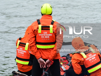 Sea rescuers on a boat monitor the descent on the Saone of the Lyon Kayak in Lyon, France, on September 22, 2024. (