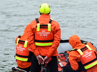 Sea rescuers on a boat monitor the descent on the Saone of the Lyon Kayak in Lyon, France, on September 22, 2024. (