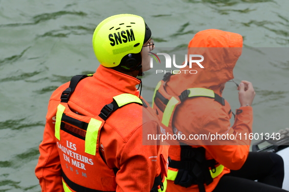 Sea rescuers on a boat monitor the descent on the Saone of the Lyon Kayak in Lyon, France, on September 22, 2024. 