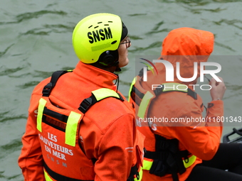 Sea rescuers on a boat monitor the descent on the Saone of the Lyon Kayak in Lyon, France, on September 22, 2024. (