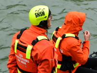 Sea rescuers on a boat monitor the descent on the Saone of the Lyon Kayak in Lyon, France, on September 22, 2024. (