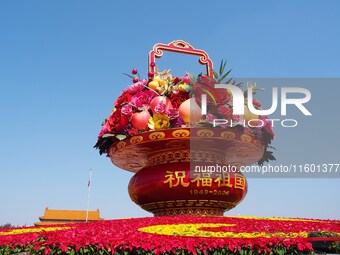 Flower baskets are seen at Tian'anmen Square to celebrate the upcoming National Day in Beijing, China, on September 23, 2024. (