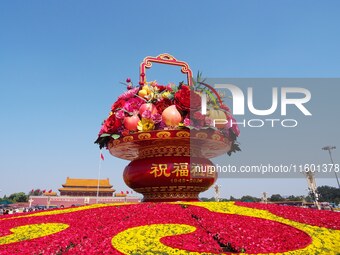 Flower baskets are seen at Tian'anmen Square to celebrate the upcoming National Day in Beijing, China, on September 23, 2024. (