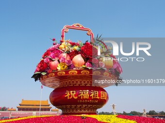 Flower baskets are seen at Tian'anmen Square to celebrate the upcoming National Day in Beijing, China, on September 23, 2024. (