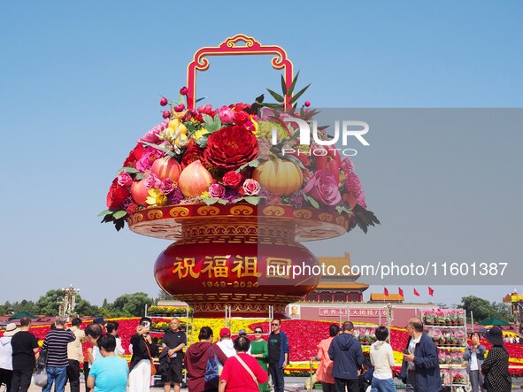 Flower baskets are seen at Tian'anmen Square to celebrate the upcoming National Day in Beijing, China, on September 23, 2024. 