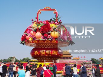 Flower baskets are seen at Tian'anmen Square to celebrate the upcoming National Day in Beijing, China, on September 23, 2024. (