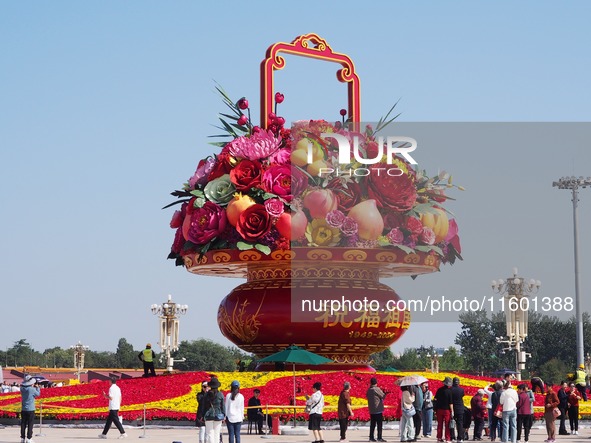 Flower baskets are seen at Tian'anmen Square to celebrate the upcoming National Day in Beijing, China, on September 23, 2024. 