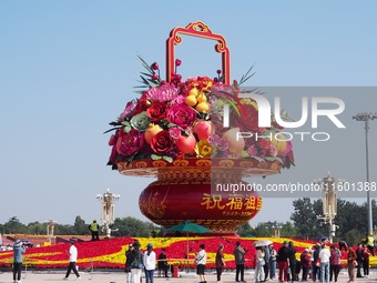 Flower baskets are seen at Tian'anmen Square to celebrate the upcoming National Day in Beijing, China, on September 23, 2024. (