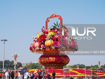 Flower baskets are seen at Tian'anmen Square to celebrate the upcoming National Day in Beijing, China, on September 23, 2024. (