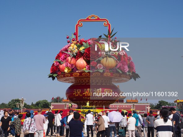 Flower baskets are seen at Tian'anmen Square to celebrate the upcoming National Day in Beijing, China, on September 23, 2024. 