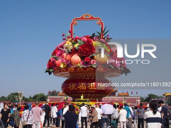 Flower baskets are seen at Tian'anmen Square to celebrate the upcoming National Day in Beijing, China, on September 23, 2024. (