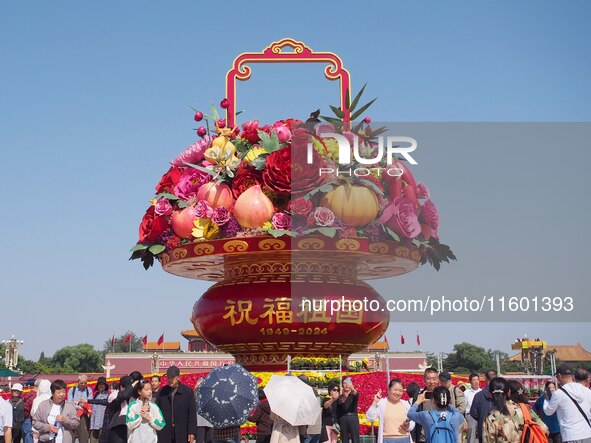 Flower baskets are seen at Tian'anmen Square to celebrate the upcoming National Day in Beijing, China, on September 23, 2024. 