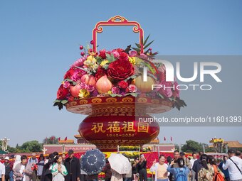 Flower baskets are seen at Tian'anmen Square to celebrate the upcoming National Day in Beijing, China, on September 23, 2024. (