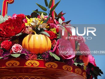 Flower baskets are seen at Tian'anmen Square to celebrate the upcoming National Day in Beijing, China, on September 23, 2024. (