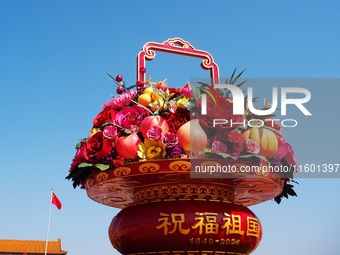 Flower baskets are seen at Tian'anmen Square to celebrate the upcoming National Day in Beijing, China, on September 23, 2024. (