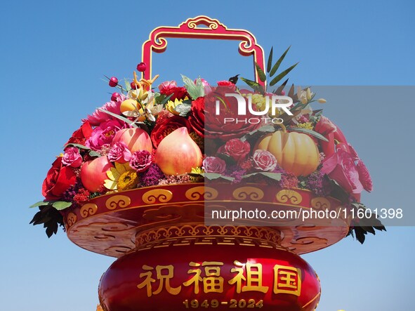 Flower baskets are seen at Tian'anmen Square to celebrate the upcoming National Day in Beijing, China, on September 23, 2024. 