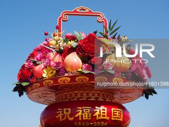 Flower baskets are seen at Tian'anmen Square to celebrate the upcoming National Day in Beijing, China, on September 23, 2024. (