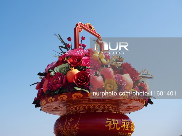 Flower baskets are seen at Tian'anmen Square to celebrate the upcoming National Day in Beijing, China, on September 23, 2024. 