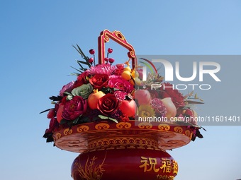 Flower baskets are seen at Tian'anmen Square to celebrate the upcoming National Day in Beijing, China, on September 23, 2024. (