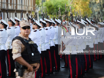 The Mayor of Madrid, Jose Luis Martinez-Almeida, presents a new national flag to the Marine Infantry Grouping of Madrid, donated by the Madr...