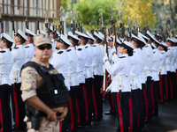 The Mayor of Madrid, Jose Luis Martinez-Almeida, presents a new national flag to the Marine Infantry Grouping of Madrid, donated by the Madr...