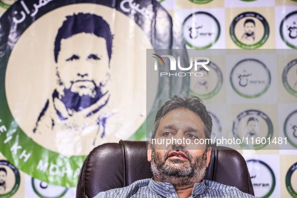 Former Srinagar Deputy Mayor Sheikh Mohammed Imran, who contests Assembly elections from the Khaniyar constituency, speaks to the media at h...